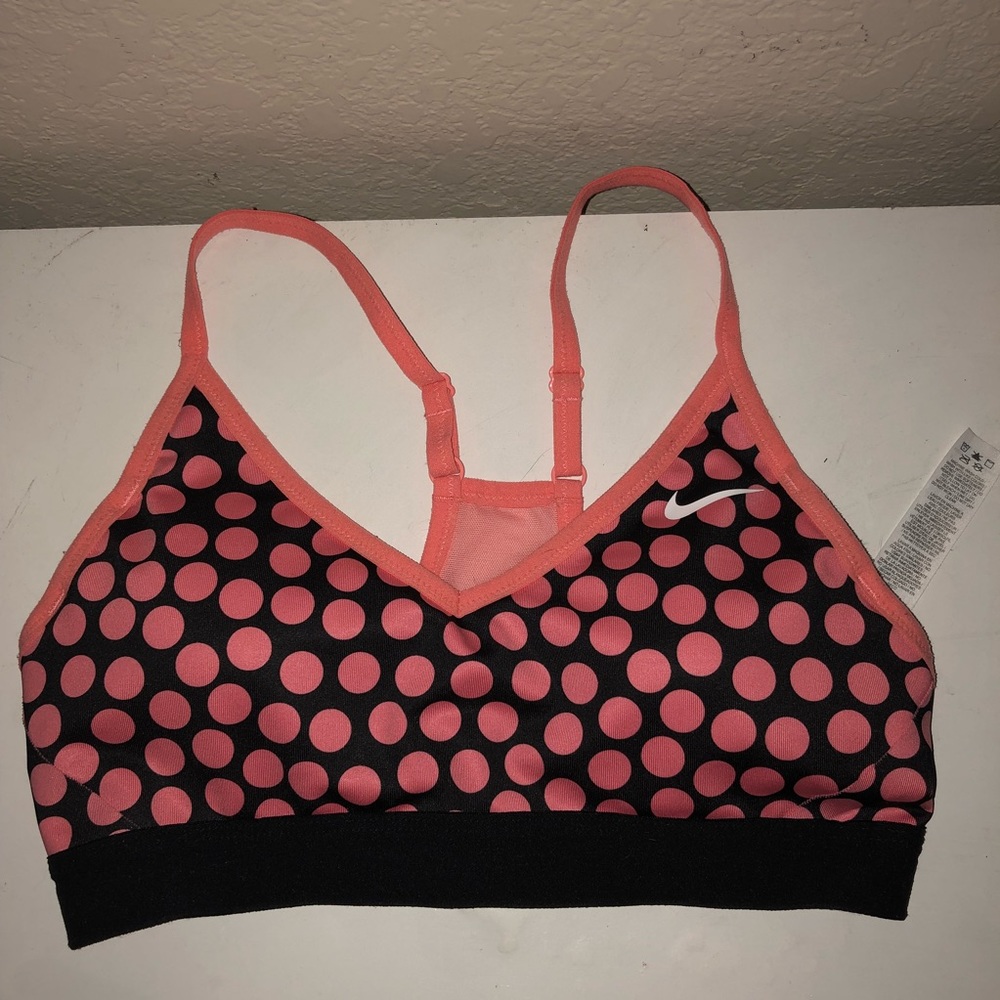 Coral-pink Nike sports bra.